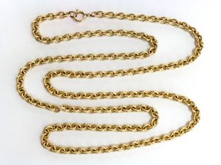 Gold rolo chain with round wire links, laid in loops